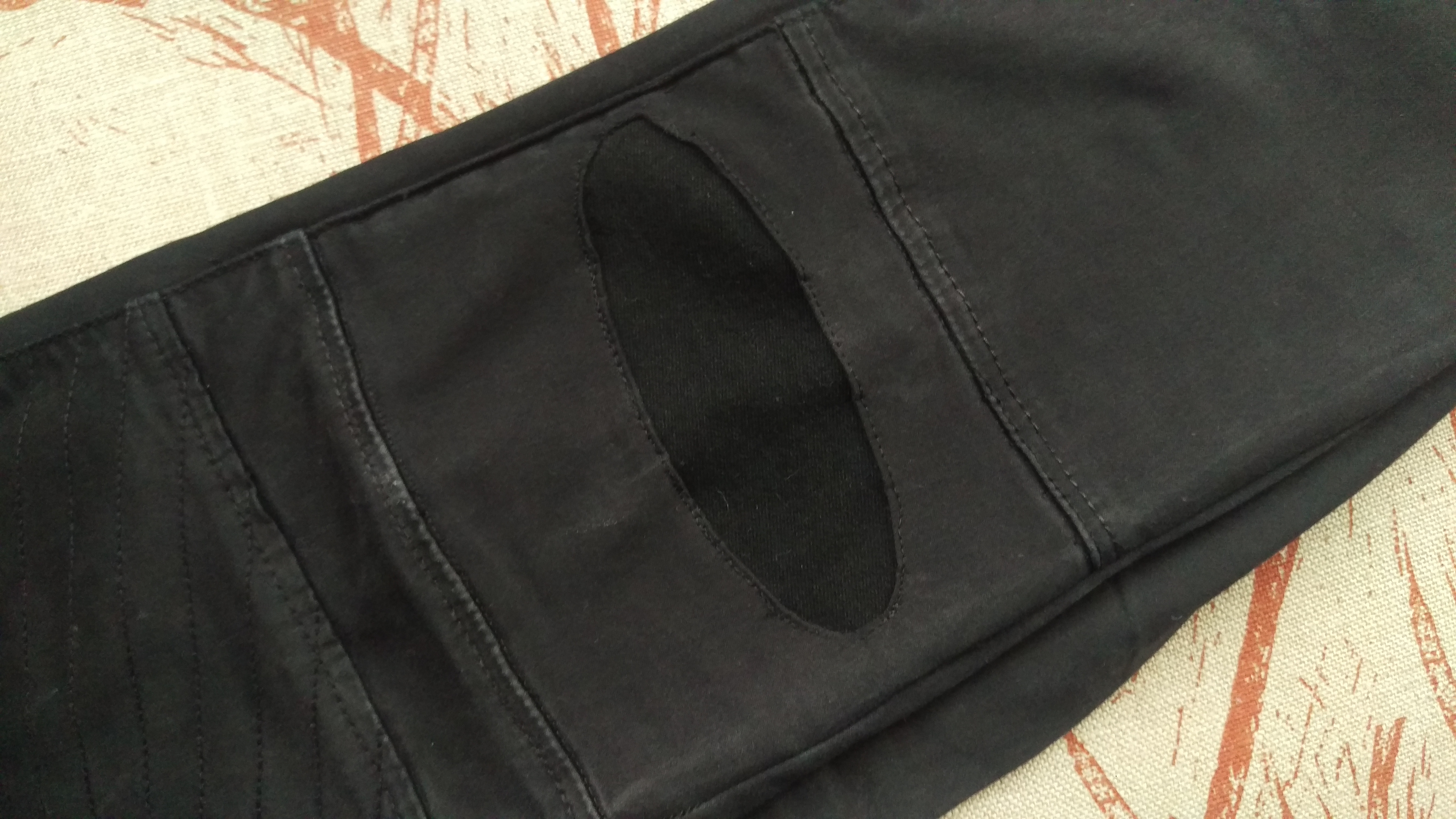 Black jeans with patch.